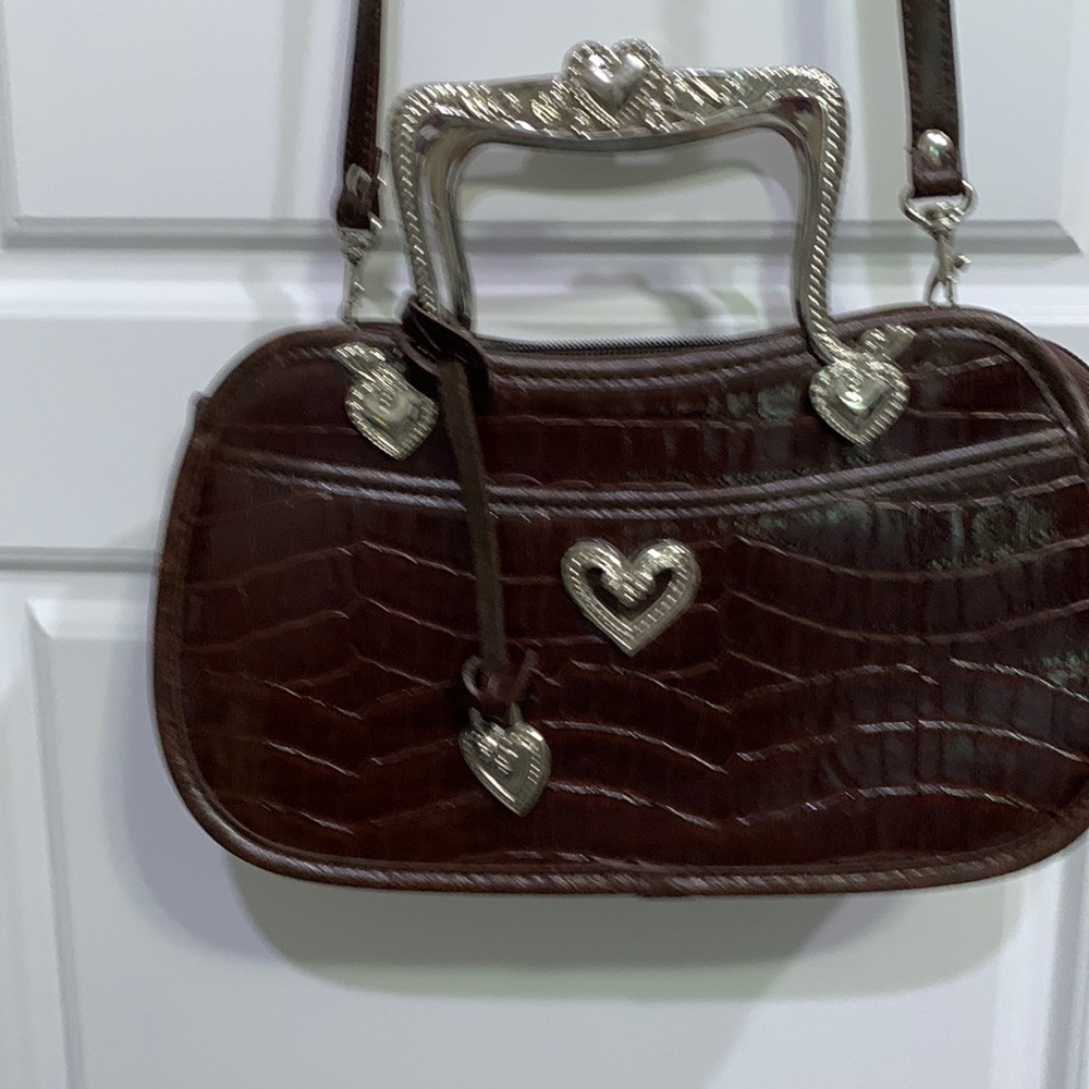 Small dark brown bag, detachable shoulder strap. Can use pretty silver handles